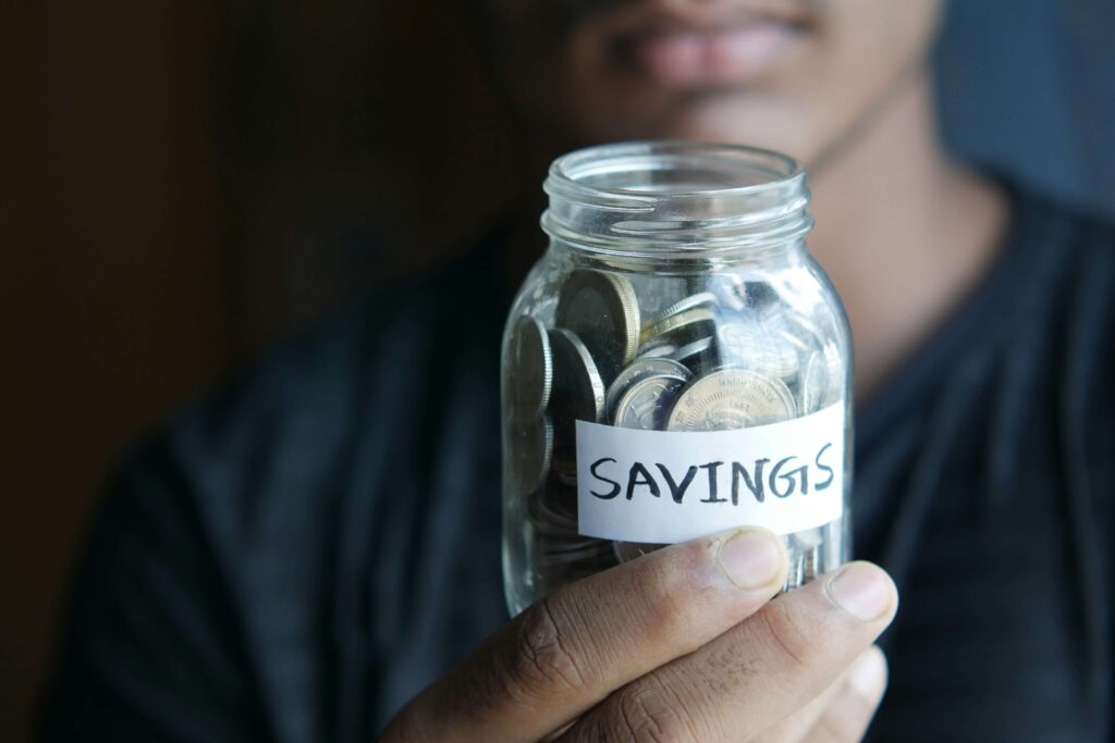 Person checking savings on a smartphone for the help to save scheme